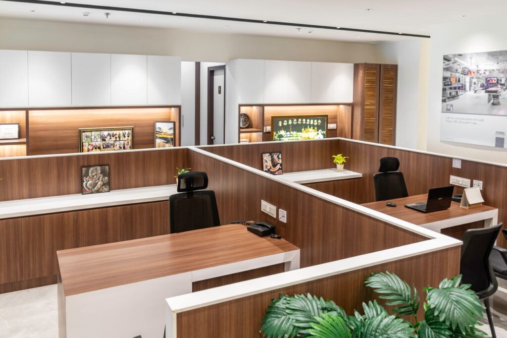 Contemporary office cubicles in a sleek, modern design with wood accents.